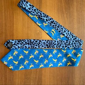 Blue Gianni Versace tie with Gold Cupid pattern.